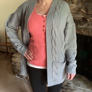 Women’s medium gray sweater.